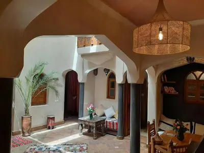 a living room with a couch and a table at Riad Sabah in Marrakech