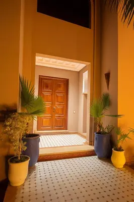 a door with potted plants in front of a room at SABOR VILLA TARGA GARDEN -Only Family in Marrakech