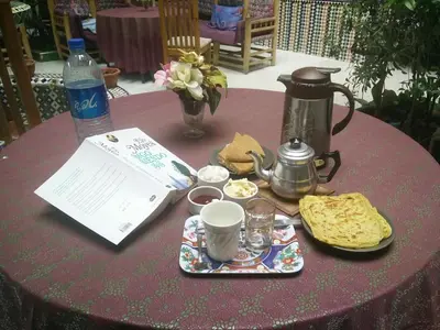 a table topped with a table with a coffee pot and food at Riad Carole - Perfect for Families & Groups in Marrakech
