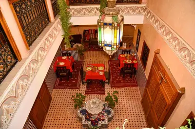 an overhead view of a restaurant with tables and chairs at Riad ZANOUBA in Marrakech