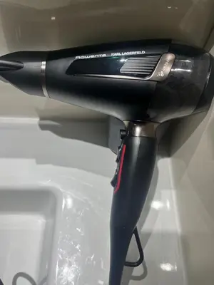 a iron is sitting on top of a sink at Appartement de Luxe -Prestigia Marrakech Golf City in Marrakech