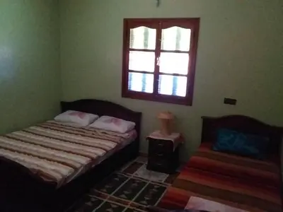 a bedroom with two beds and a window at House of Travelers in Marrakech in Marrakech