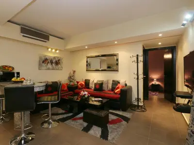 a living room with a couch and a table at Ghita Appartement in Marrakech