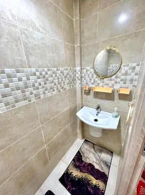 a bathroom with a sink and a mirror at Appartement marrakech de lux in Marrakech