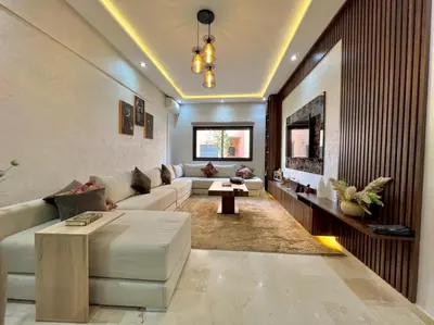 a living room with a couch and a table at Appartement marrakech de lux in Marrakech