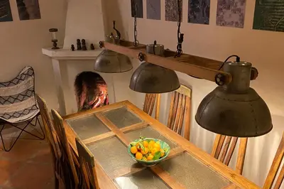 a table with two bells and a bowl of vegetables at Riad Of The Storks in Marrakech