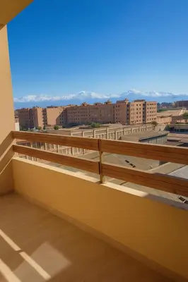 a balcony with a view of the city at Appartement Nour 5 Marrakech Centre Gueliz avec piscine in Marrakech