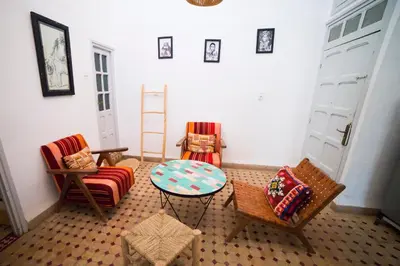 a living room with two chairs and a table at The Loft in Marrakech