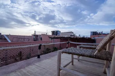 a bench sitting on top of a balcony at The Loft in Marrakech