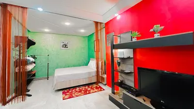 a room with a red and green wall at BAGATELLE STUDIO GUELIZ in Marrakech