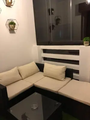 a couch sitting in a room with a window at Beautiful Luxury 2 bedrooms Apartment in Marrakech in Marrakech