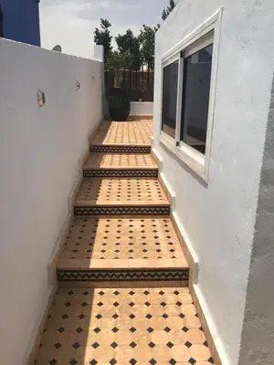 a set of stairs leading up to a window at Riad Syrine in Marrakech