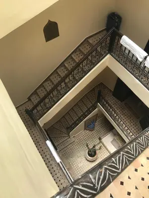 an overhead view of a bathroom with a tile floor at Riad Syrine in Marrakech