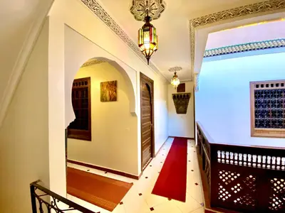 a hallway of a home with an archway at Riad Jibraile in Marrakech