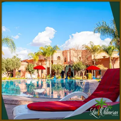 a pool at the disney wilderness resort at Las Palmeras Guest House in Marrakech