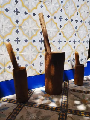 three wooden utensils sitting on the floor in a bathroom at Riad Bouchouari 33 in Marrakech