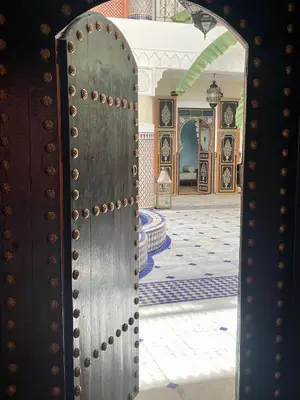 an open door in a room with a room with a floor at Riad Ksar Al Amal & Spa in Marrakech