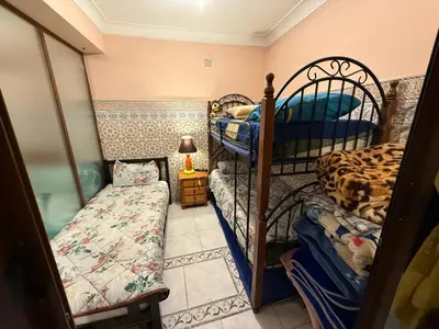 a bedroom with two bunk beds and a small bed at Dar El Azzouzi in Marrakech