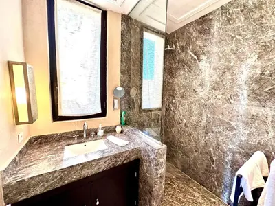 a bathroom with a sink and a shower at Al Maaden Ryad 69 a Marrakesh in Marrakech