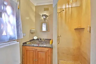 a bathroom with a sink and a shower at Riad Amya & Spa in Marrakech