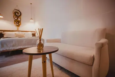 a living room with a couch and a table at Riad Tizou in Marrakech
