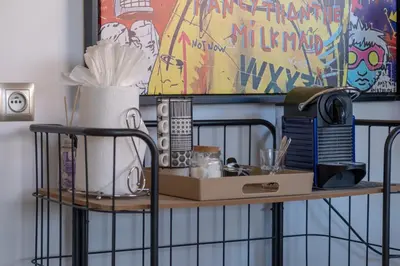 a shelf with a box and other items on it at Prestigia, superbe appartement, vue sur golf, piscine et Atlas in Marrakech
