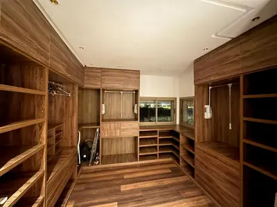 a large room with wooden walls and shelves at Prestigia, superbe appartement, vue sur golf, piscine et Atlas in Marrakech