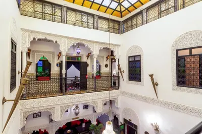 a view of the inside of a mosque with stained glass windows at Riad La Porte d'Or & SPA in Marrakech