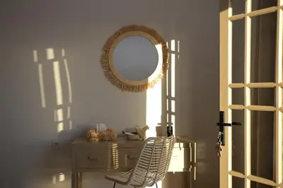 a room with a table and a mirror and a chair at Villa Nour in Marrakech