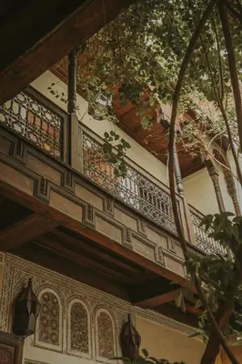 a balcony of a building with a clock on it at Riad Samsara in Marrakech