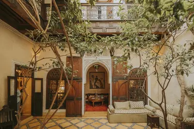 a living room with a couch and a table at Riad Samsara in Marrakech