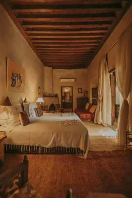 a bedroom with a large bed in a room at Riad Samsara in Marrakech