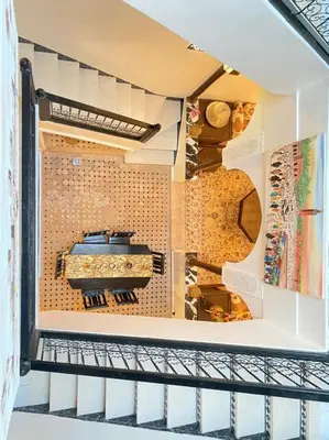 a shelf in a kitchen with a stove in it at Un Riad pour se divertir en famille & se détendre in Marrakech