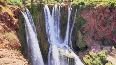 a waterfall on the side of a cliff at Hôtel Faouzi in Marrakech