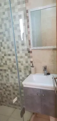 a bathroom with a sink and a mirror at appart Marrakech in Marrakech