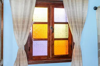 a close up of a glass door with curtains at Riad La Famille in Marrakech