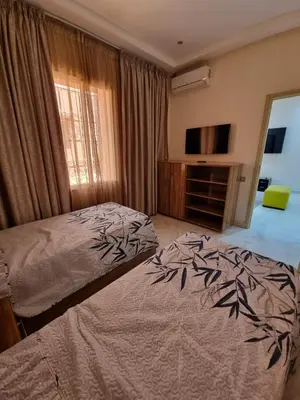 a bedroom with a bed and a flat screen tv at Marrakech medina inn in Marrakech
