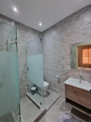 a bathroom with a shower and a toilet and a sink at Marrakech medina inn in Marrakech