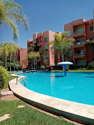 a large swimming pool in front of a building at HERMINIE ATLAS in Marrakech