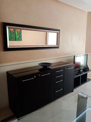 a living room with a mirror and a tv at HERMINIE ATLAS in Marrakech