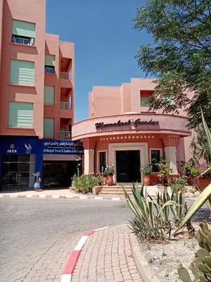 a building on the side of a street at HERMINIE ATLAS in Marrakech