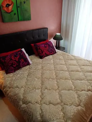 a bed with two pillows on it in a bedroom at HERMINIE ATLAS in Marrakech
