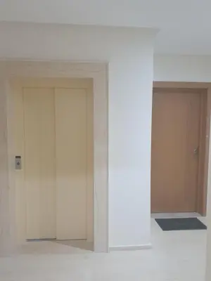 two white doors in a room with a wall at Deluxe Apartment in Marrakesh. hevernage flat in Marrakech