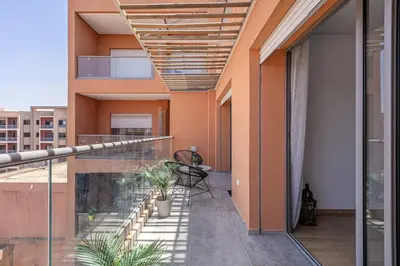 a balcony of a house with plants on it at Haut-Standing, Marrakech Guéliz, Piscine in Marrakech