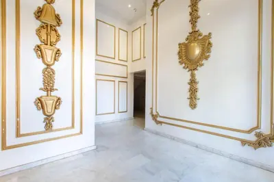 a hallway with gold decorations on the walls at NEW! Cosy, Lux , Gueliz centre, Iptv in Marrakech