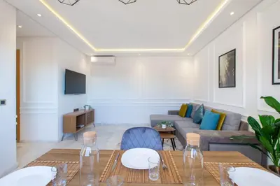 a living room with a couch and a table at NEW! Cosy, Lux , Gueliz centre, Iptv in Marrakech