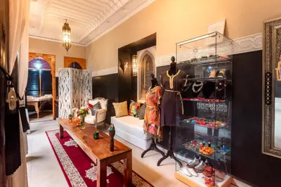 a room with a display case filled with clothes at Riad Rodaina & SPA in Marrakech