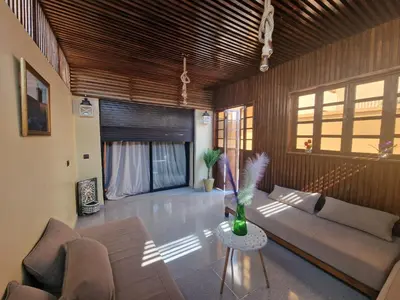a living room with a couch and a table at Bonheur Partagé 1 in Marrakech