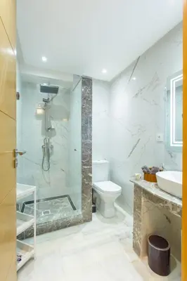 a bathroom with a shower and a toilet and a sink at NEW! Luxury’n Colorful, Gueliz in Marrakech