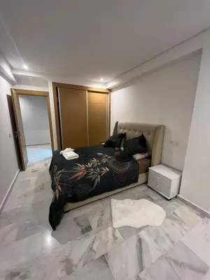 a bedroom with a bed and a tiled floor at PALACE B Av Hassan II Marrakech 40000 -Brand New Luxury UNIT#2 & UNIT#29 in Marrakech